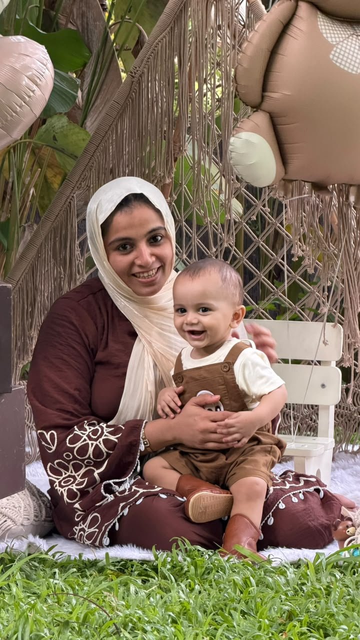 Mother and child smiling together at a family celebration